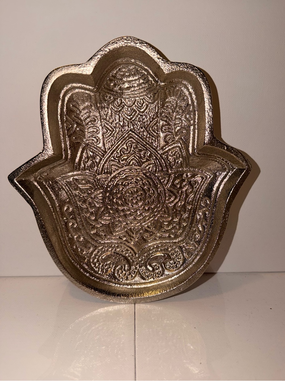 Decorative Hamsa Hand Trinket Dish in Metallic Silver.